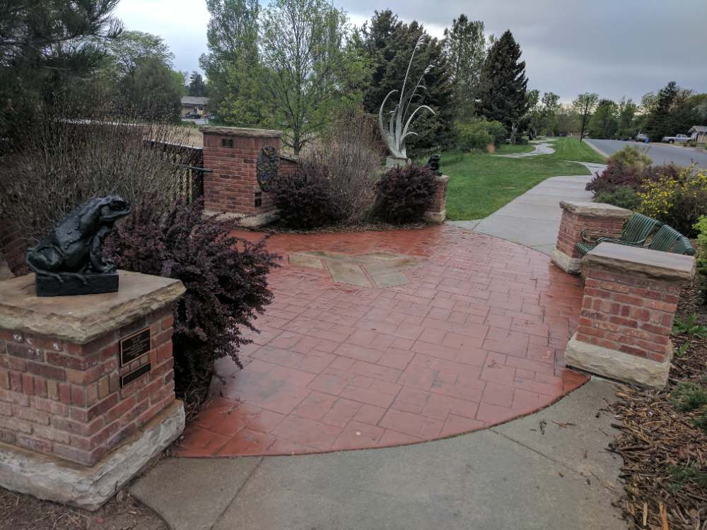 Bronze sculptures among trees at Benson Sculpture Garden in Loveland, Colorado
