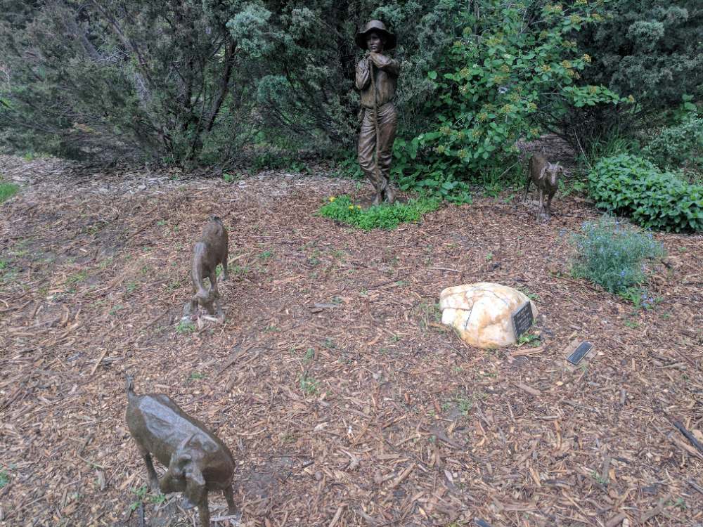 Close-up of the bronze sculpture Shepherd Boy by Judy Black on display in Loveland, Colorado
